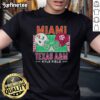 Official Miami Hurricanes vs Texas A&M Aggies 2025 College Football Helmets Playoff T-Shirt featuring team logos.