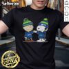 Alt Text: Official Peanuts Charlie Brown fist bump with Snoopy on Seattle Seahawks football T-shirt, perfect for fans.