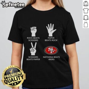 Alt Text: Official San Francisco 49ers ladies tee featuring 'Nothing Beats Rock, Paper, Scissors' slogan in team colors.