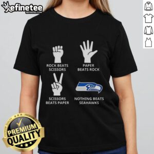 Alt Text: Official Seattle Seahawks ladies tee featuring 'Nothing Beats Rock, Scissors, Paper Beats Rock, Scissors Beats Paper' design.