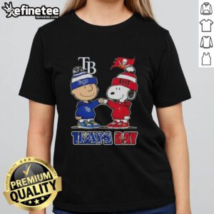 Alt Text: Original Charlie Brown fist bump with Snoopy, celebrating Tampa Bay sports - Rays and Buccaneers ladies tee design.