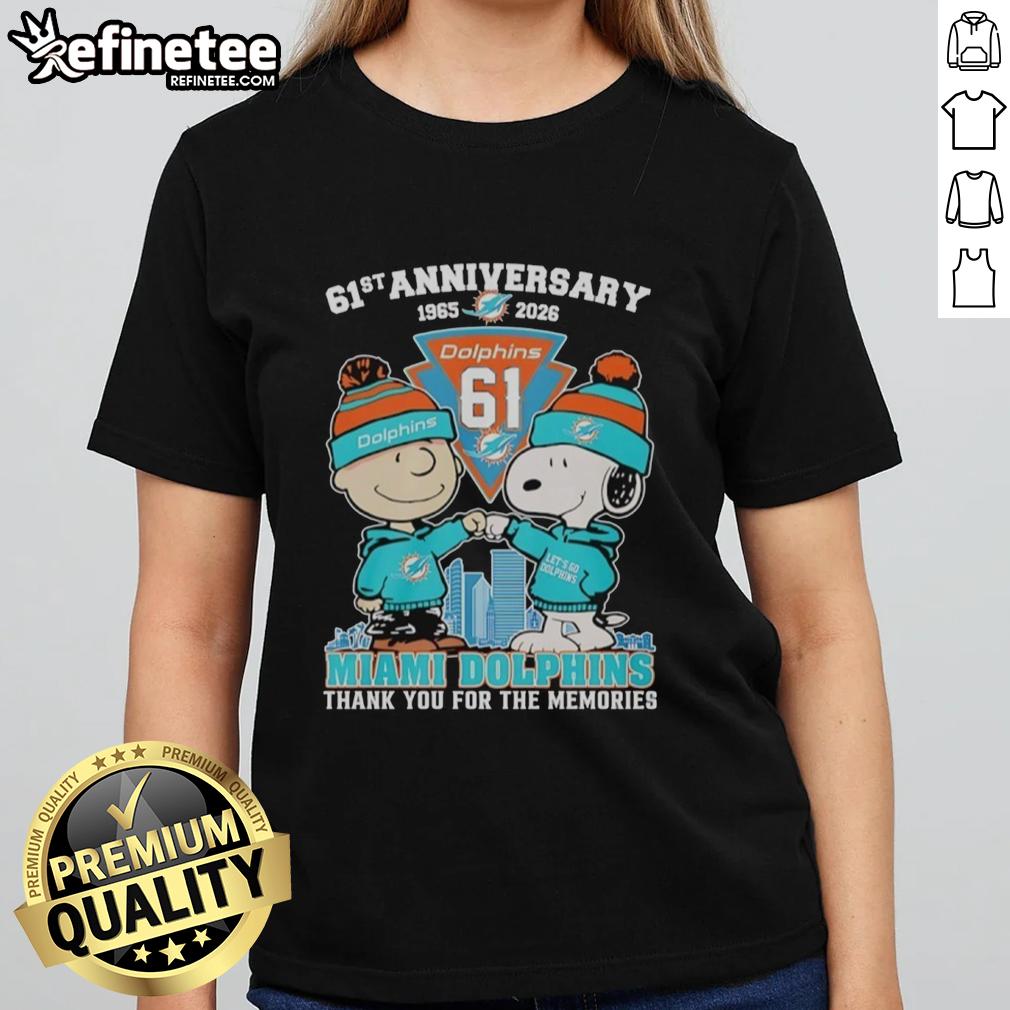 Original Miami Dolphins outfit featuring Snoopy and Charlie Brown, celebrating the 61st anniversary 1965-2026 on ladies' tee.