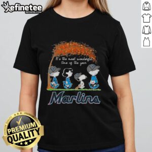 Alt Text: Premium Miami Marlins X Peanuts Snoopy and Friends autumn ladies tee featuring festive holiday design.