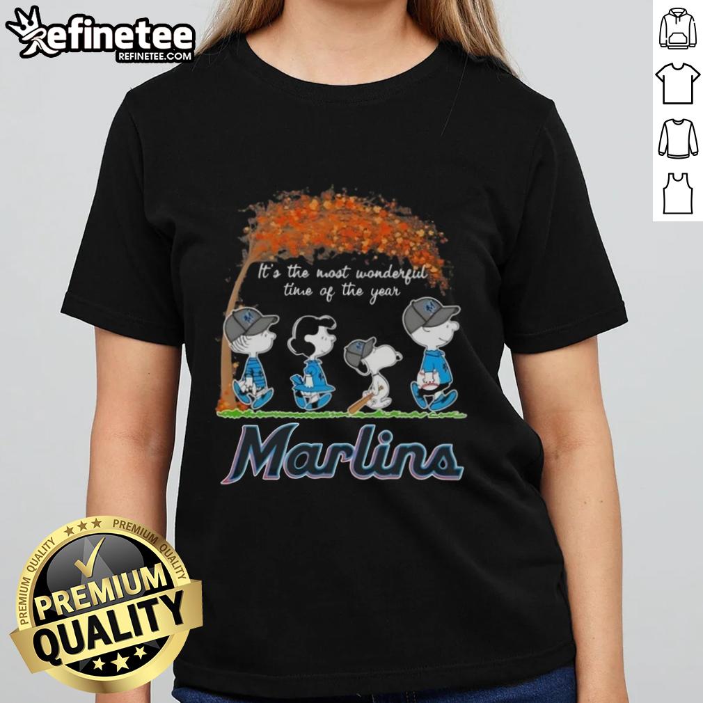 Alt Text: Premium Miami Marlins X Peanuts Snoopy and Friends autumn ladies tee featuring festive holiday design.