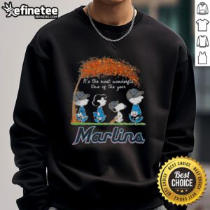 Alt Text: Premium Miami Marlins X Peanuts Snoopy and Friends sweatshirt featuring autumn design, perfect for the holiday season.