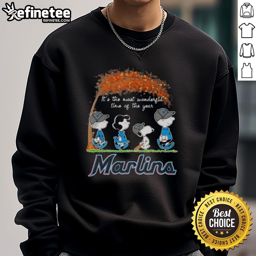 Alt Text: Premium Miami Marlins X Peanuts Snoopy and Friends sweatshirt featuring autumn design, perfect for the holiday season.