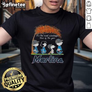 Alt Text: Premium Miami Marlins X Peanuts Snoopy and Friends autumn T-shirt celebrating the holiday season.