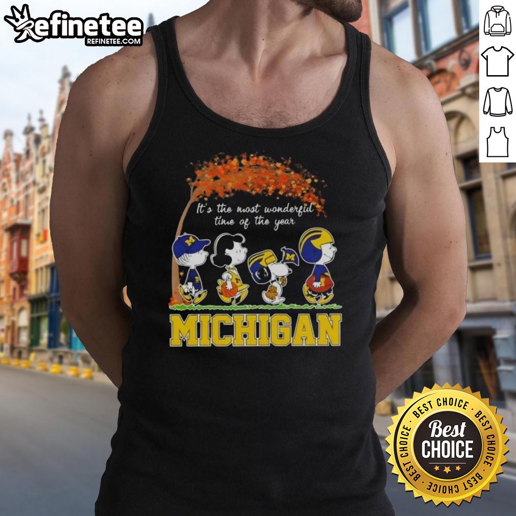 Alt Text: Premium Michigan Wolverines tank top featuring Snoopy and friends celebrating autumn and the joy of the season.