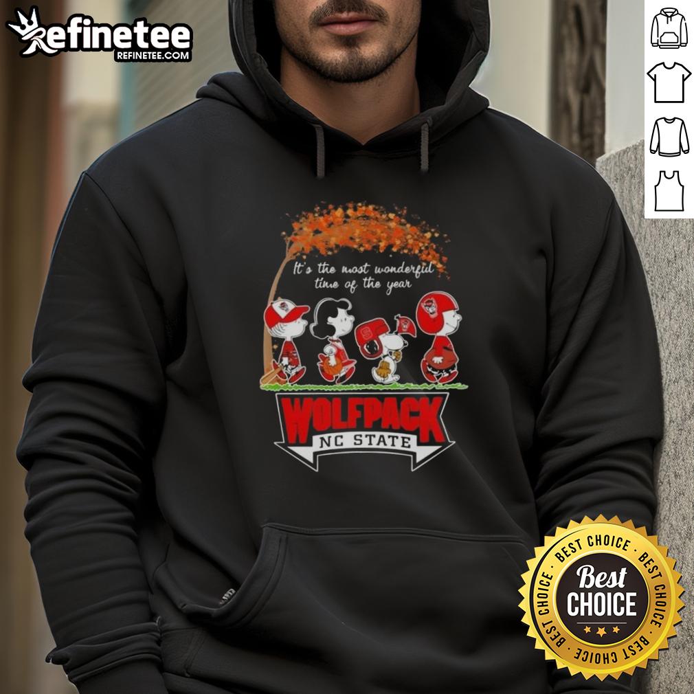 Premium NC State Wolfpack hoodie featuring Snoopy and friends celebrating autumn and the holiday season.