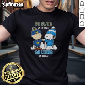 Pretty Charlie Brown fist bump with Snoopy on a blue Detroit Lions skyline t-shirt for game day excitement.