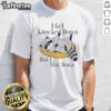 Good Raccoon meme t-shirt featuring 'I Get Knocked Down But I Stay Down' text with a cute raccoon illustration.