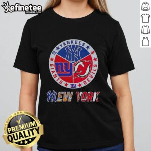 Ladies tee featuring combined logos of New York Yankees, Devils, and Giants for sports fans in NYC.