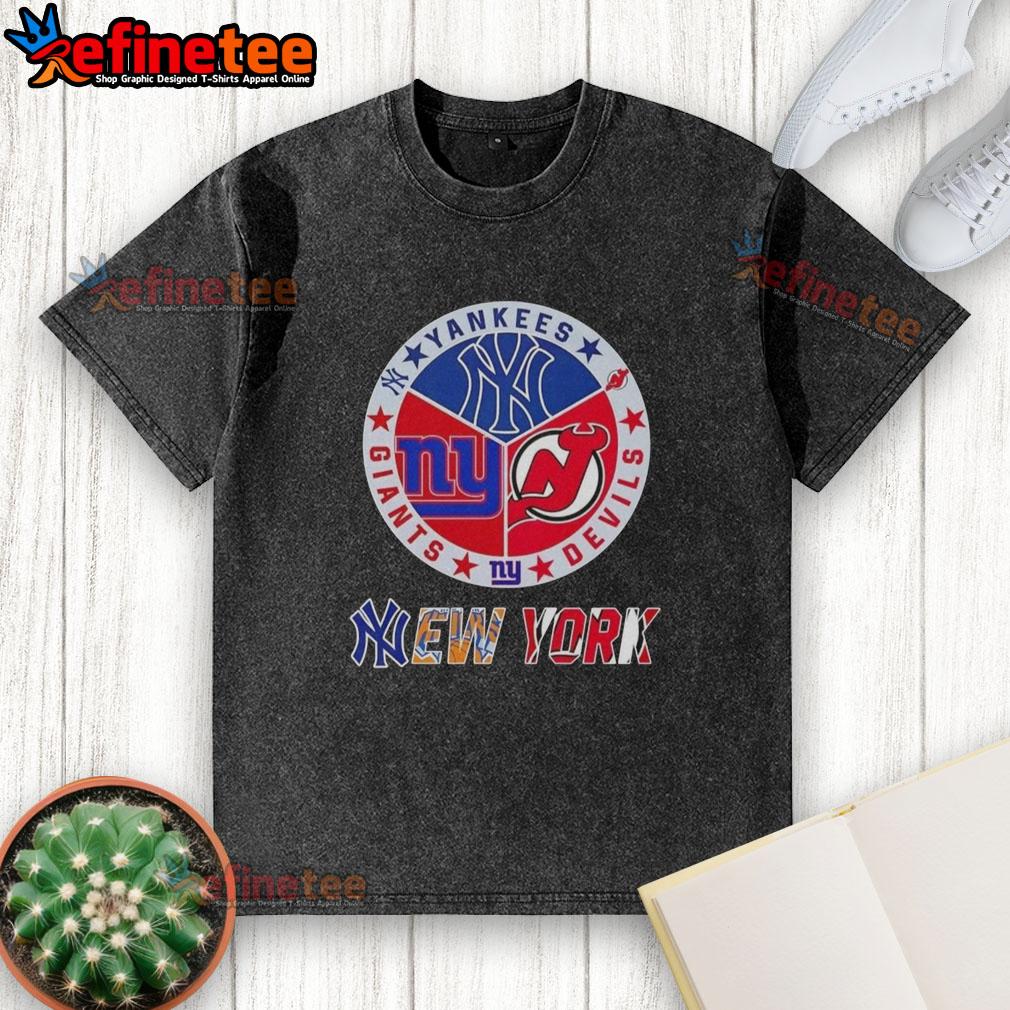 Alt Text: Washed t-shirt featuring combined logos of Yankees, Devils, and Giants, perfect for NYC sports fans.