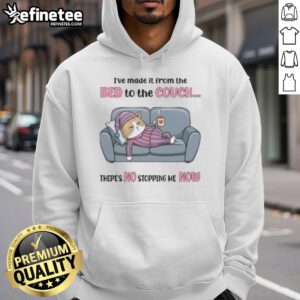 Top tired cat in cozy hoodie lounging on couch after a long day, showcasing the 'I've made it from the bed' theme.