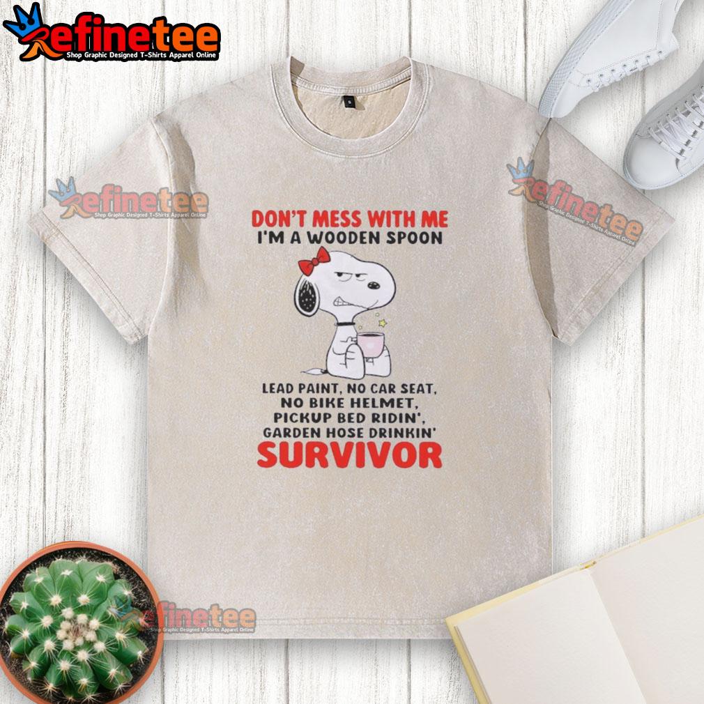 Snoopy graphic t-shirt reading 'Don't Mess With Me I'm A Wooden Spoon Survivor' with playful design and vibrant colors.