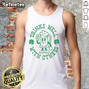 St. Patrick's Day tank top featuring 'Official Drinks Well With Others' slogan and shamrock design for festive celebrations.