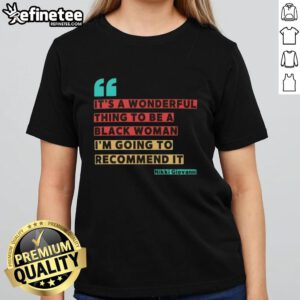 Alt Text: Black woman wearing 'It's A Wonderful Thing To Be A Black Woman' tee by Nikki Giovanni, showcasing empowerment and pride.