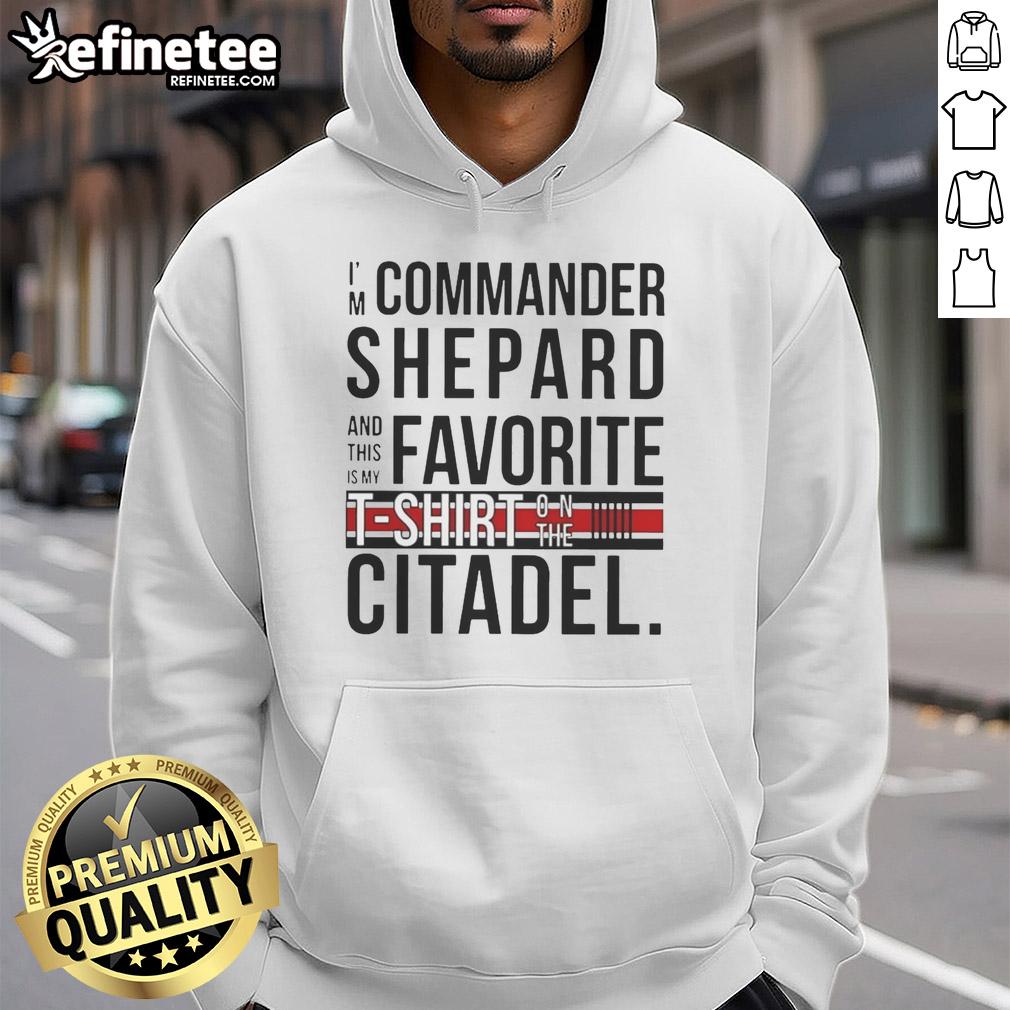 Alt Text: Commander Shepard wearing an 'Awesome I'm Commander Shepard and This Is My Favorite Shirt' hoodie on the Citadel.