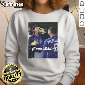 Awesome Jac Caglianone of Kansas City Royals sipping espresso in dugout zone, wearing Almost Friday sweatshirt.