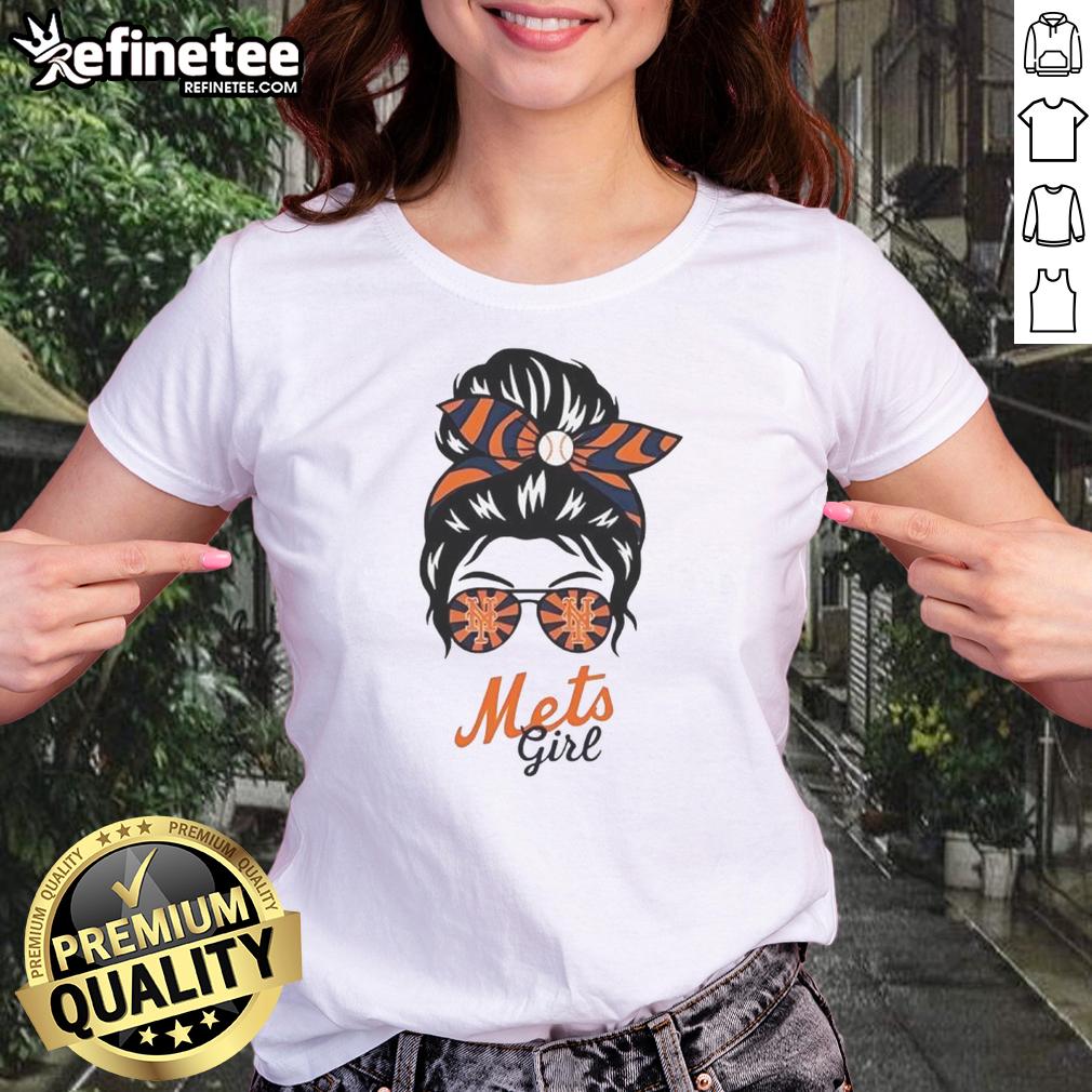 Official New York Mets girl in messy bun and glasses wearing a stylish ladies tee, showcasing team spirit.