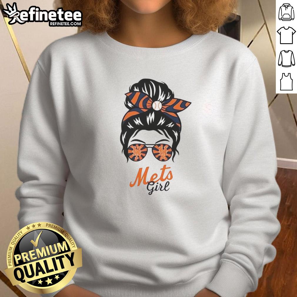 Official New York Mets girl in a messy bun and glasses wearing a stylish sweatshirt, perfect for game day.