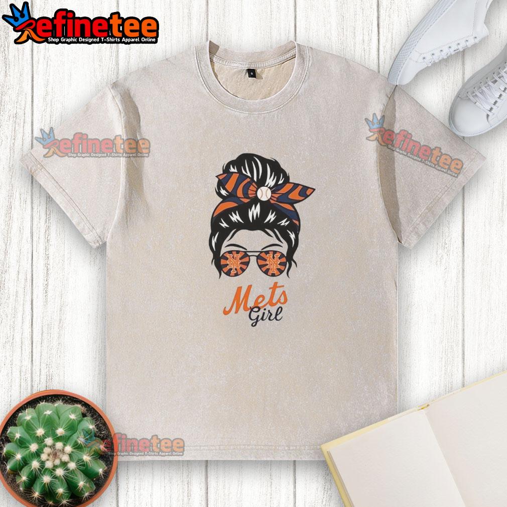 Official New York Mets girl in a messy bun and glasses wearing a washed t-shirt, showcasing team spirit and style.