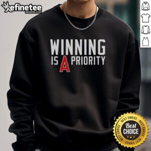 Original Los Angeles Angels 'Winning is Angels Priority' sweatshirt featuring team colors and logo, perfect for fans.