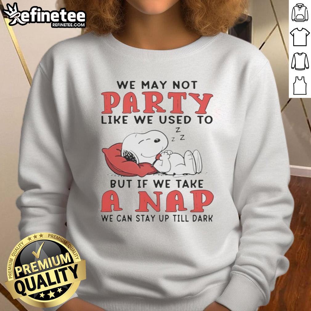 Cozy sweatshirt featuring Snoopy with 'We may not party like we used to' quote, perfect for casual wear and napping.