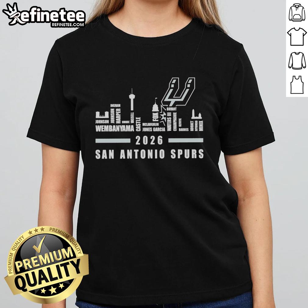 Alt Text: Premium San Antonio Spurs NBA 2026 ladies tee featuring player names and city skyline design.