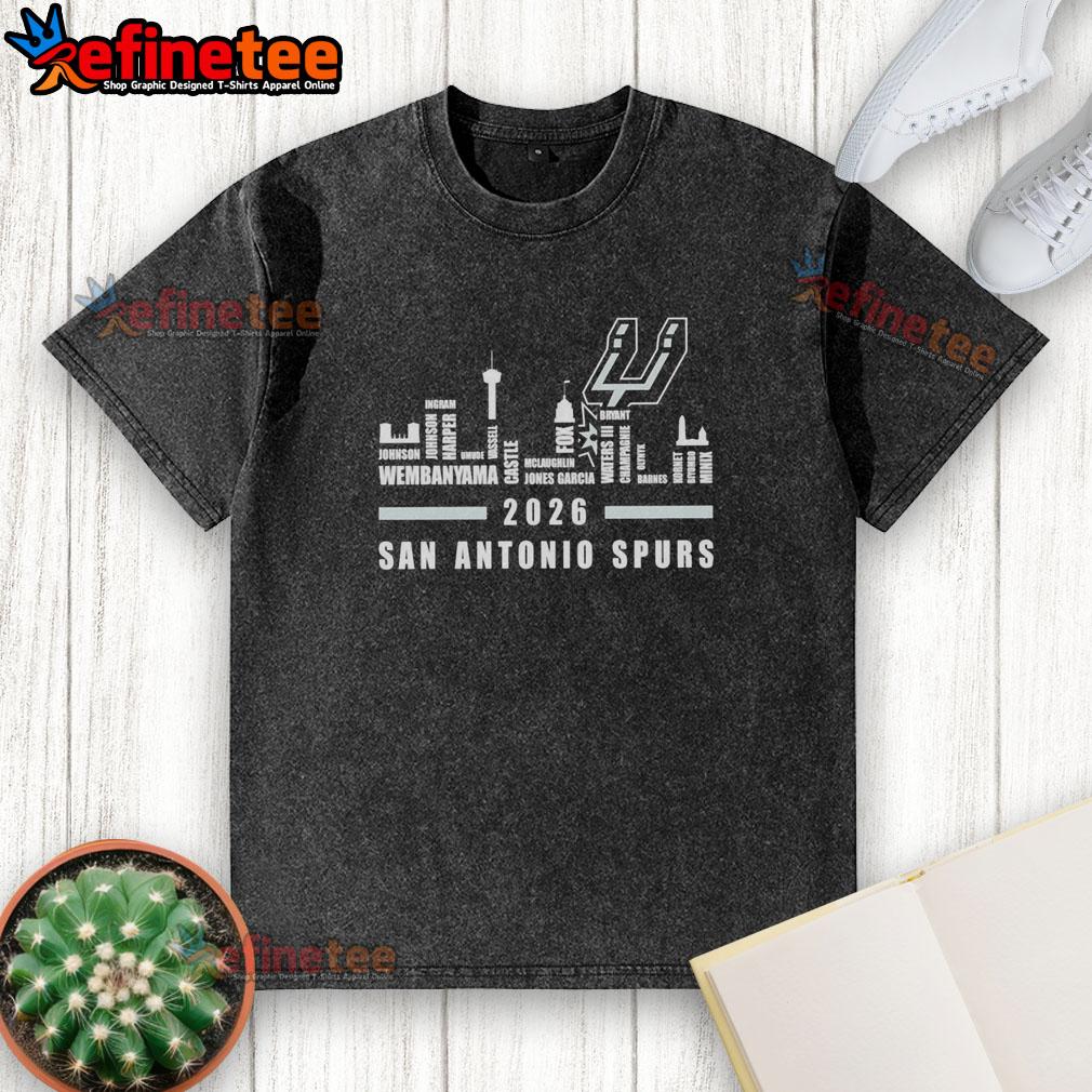 Premium San Antonio Spurs NBA 2026 washed t-shirt featuring player name and city skyline design.