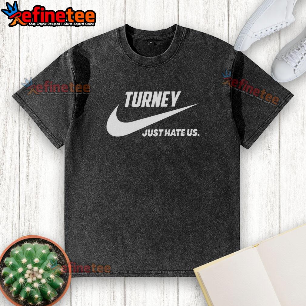 Official Turney Just Hate Us parody logo on a washed t-shirt, featuring a playful design for casual wear.