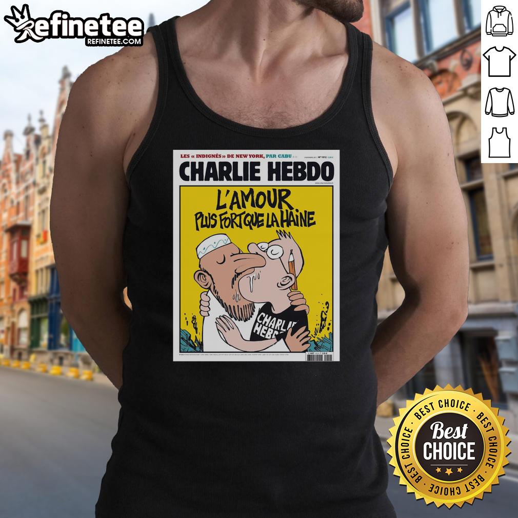 Alt Text: Two men kissing in a tank top featuring the L'Amour Plus Fort Que La Haine design from Charlie Hebdo.