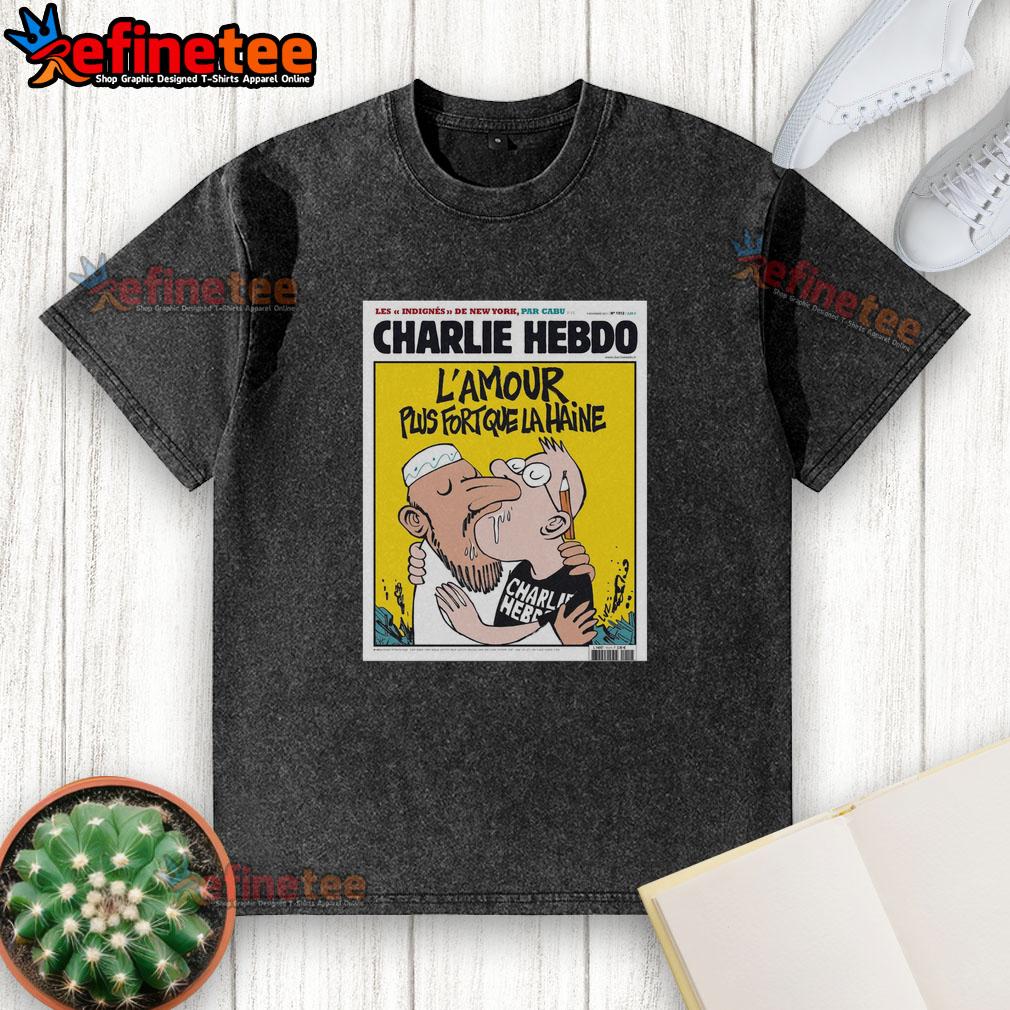 Alt Text: Official Charlie Hebdo 'L'Amour Plus Fort Que La Haine' washed t-shirt featuring two men kissing, promoting love and acceptance.