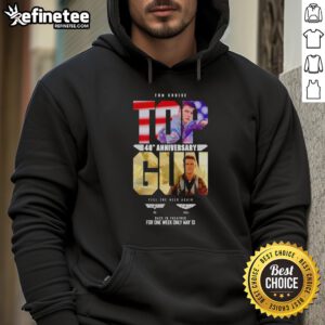 Alt Text: Tom Cruise in Top Gun Maverick 40th Anniversary hoodie, promoting Feel The Need Again event May 13.