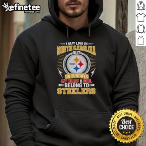 Cozy hoodie featuring 'I live in North Carolina but my heart belongs to Steelers' design, perfect for Pittsburgh Steelers fans.