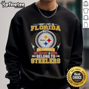 Cozy sweatshirt with 'I May Live in Florida But My Heart Belongs to Steelers' design, perfect for Pittsburgh Steelers fans.