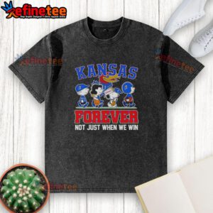 Alt Text: Cartoon characters on a washed t-shirt celebrating Kansas Jayhawks fandom, Top Peanuts x Kansas Jayhawks Forever Fan.