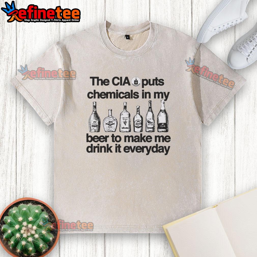 Vintage washed t-shirt featuring the phrase The CIA Puts Chemicals In My Beer for a humorous, conspiracy-themed style.