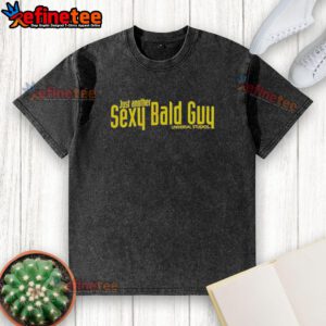 Hot bald guy wearing a washed Universal Studios t-shirt, showcasing a stylish and relaxed look.