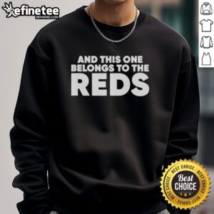 Alt Text: Ashley Davis wearing a stylish This One Belongs to The Reds sweatshirt, showcasing a trendy casual look.