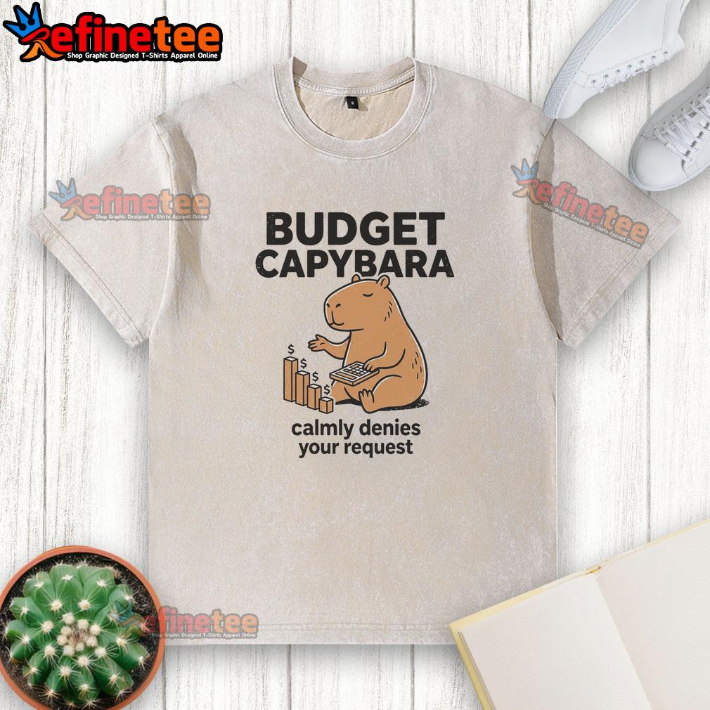 Alt Text: Cute capybara in a washed t-shirt calmly denies your request, showcasing a pretty budget-friendly vibe.