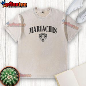 Alt Text: Colorful 'Pretty Mariachis' Day of the Dead sugar skull design on a washed t-shirt, perfect for festive celebrations.