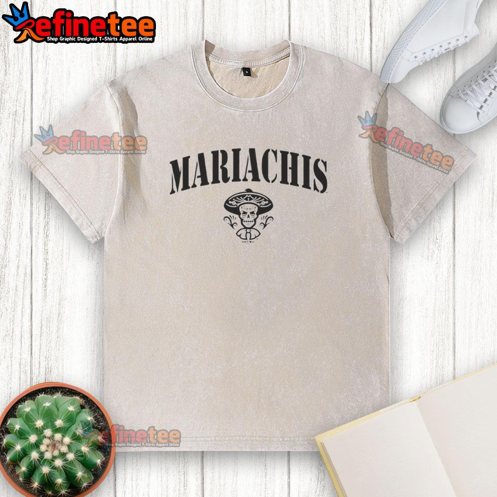 Alt Text: Colorful 'Pretty Mariachis' Day of the Dead sugar skull design on a washed t-shirt, perfect for festive celebrations.