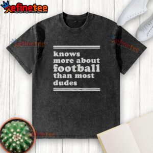 Top Knows More About Football Than Most Dudes washed t-shirt featuring a fun football graphic and playful text design.