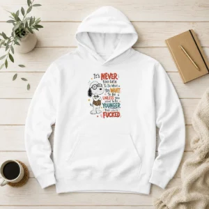 Awesome Snoopy Peanuts It Is Never Too Late To Be What You Want Unless You Are Fcked Hoodie in black, front view with bold graphic print