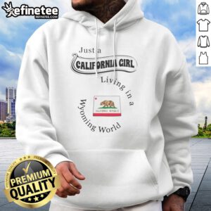 Good Just A California Girl Living In A Wyoming World hoodie in soft fabric, featuring bold white text on a black pullover